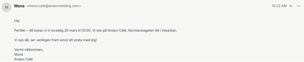Mona's email confirming an in-person interview at the café with a candidate